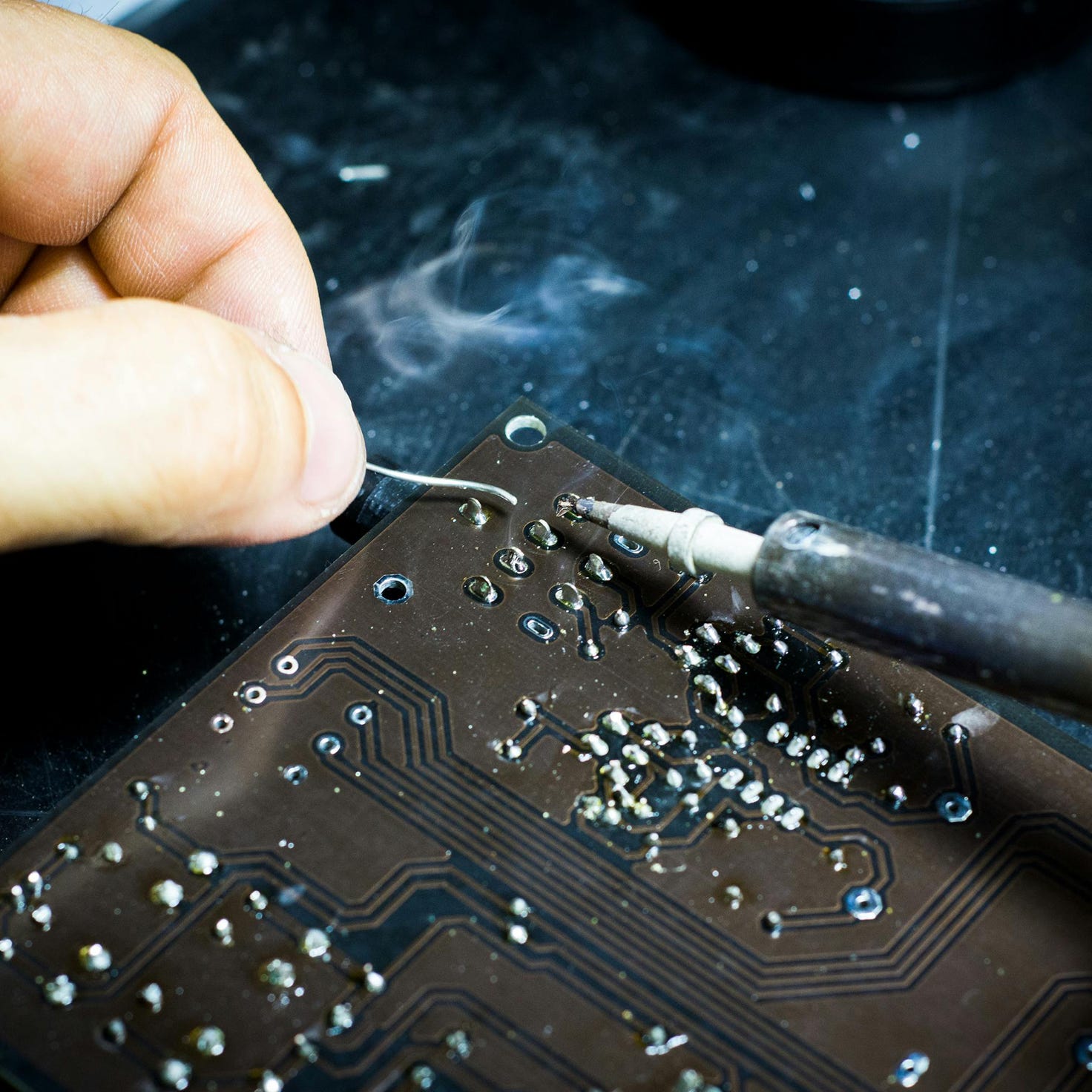 Person Soldering Chip